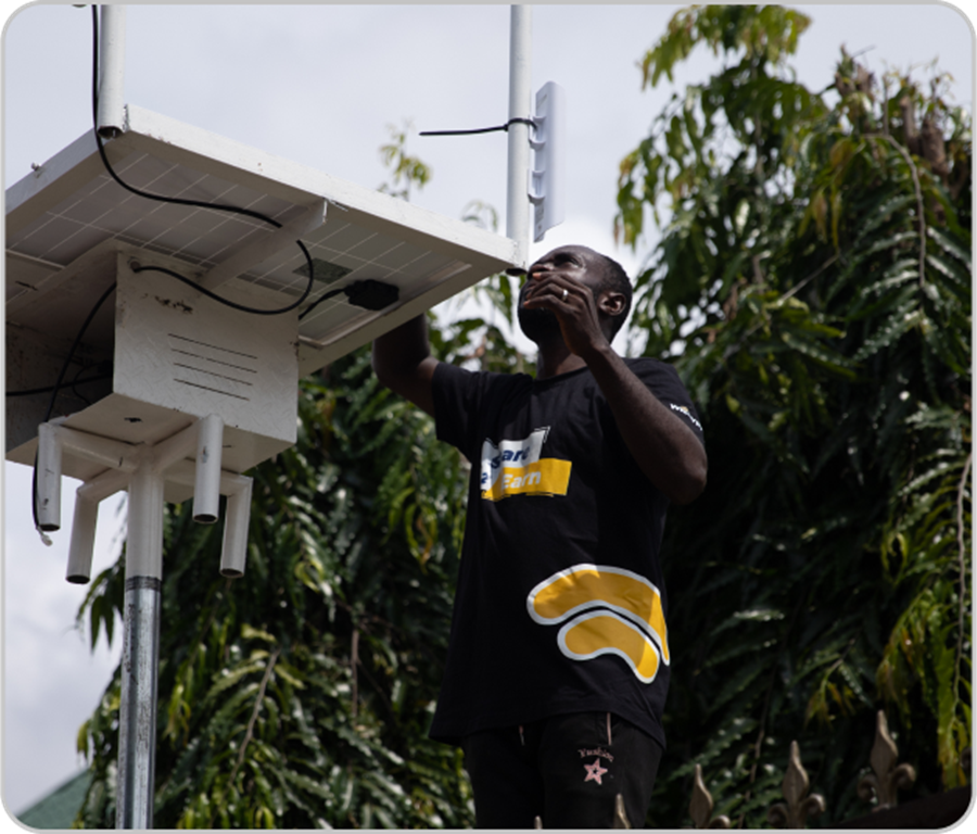 Photo of an engineer installing a Wicrypt City WiFi station